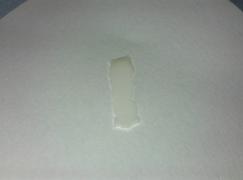 a piece of fluorographene on a filter paper